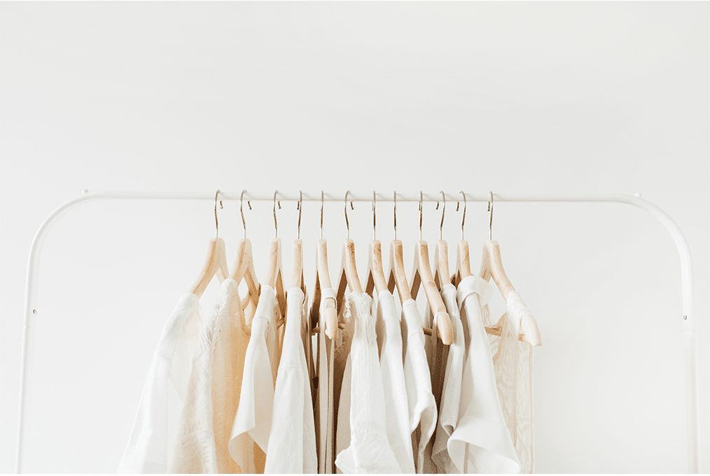 Bamboo-side1 White and beige shirts hanging on a clothing rack
